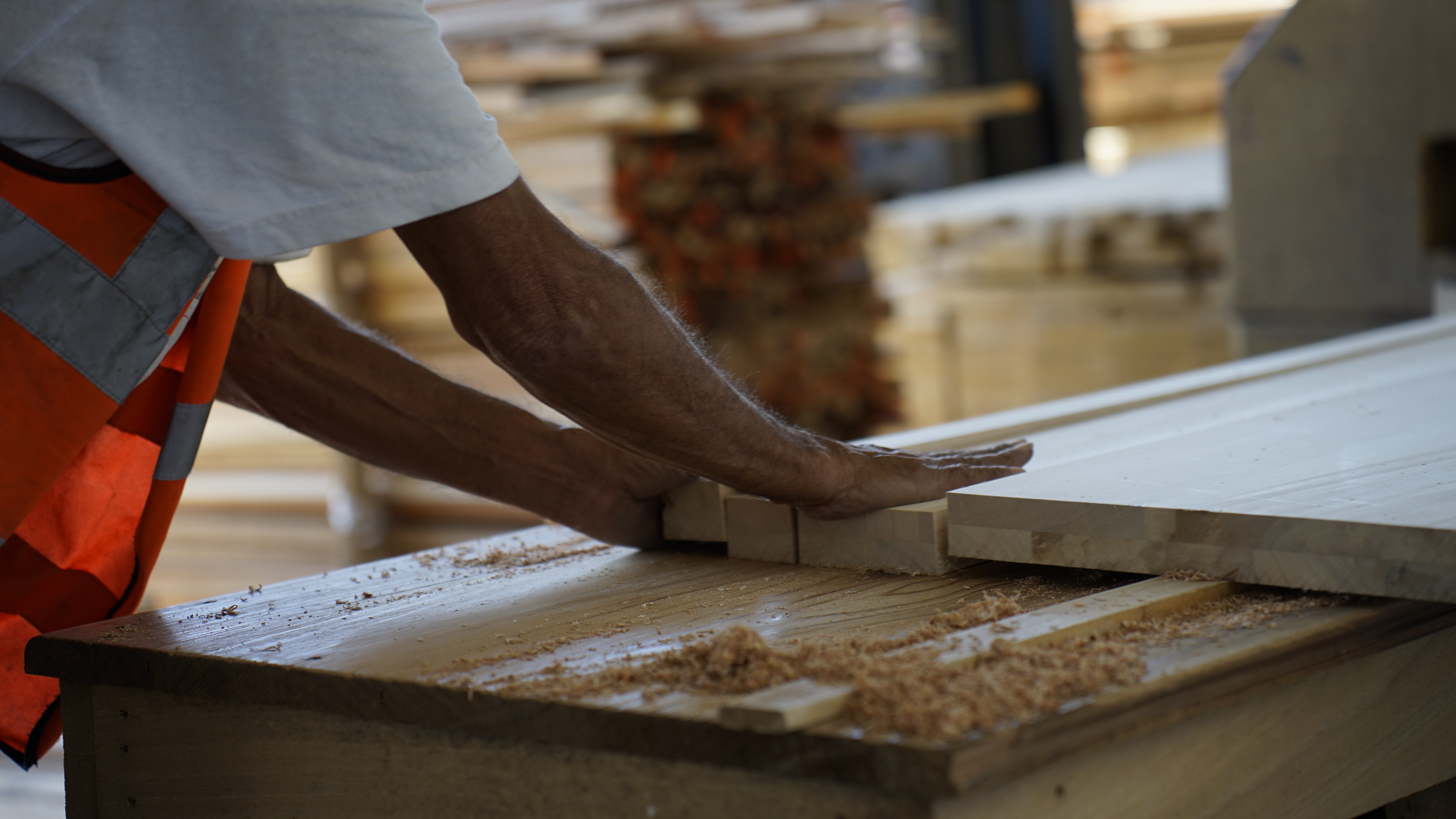 Close-up of stacked hardwood boards showing grain and color variation